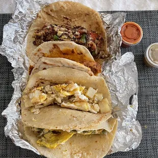 Delicious line up includes nopalitos con huevo, papa con huevo, frijol con chorizo on harina, machacado