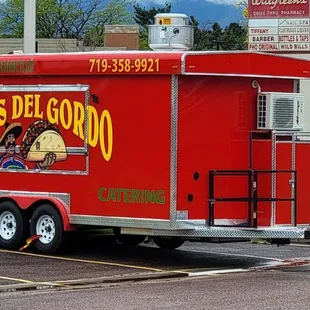 a taco truck in a parking lot