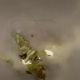 Un cooked carne asada sope that literally burned through the styrofoam.