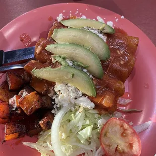 Enchiladas Del Julio with avocado and pulled chicken