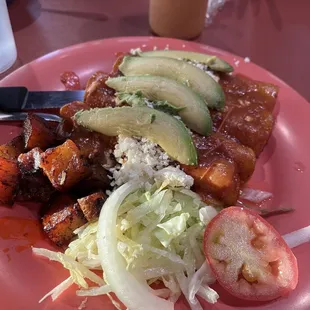 Enchiladas Del Julio with avocado and pulled chicken.