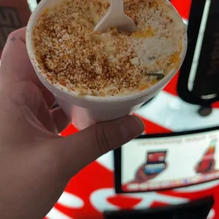 a person holding a bowl of food