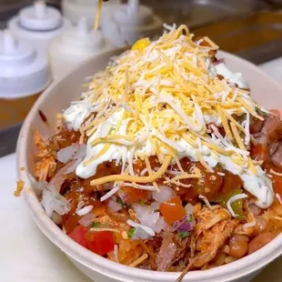 Rice bowl with many possible proteins and toppings