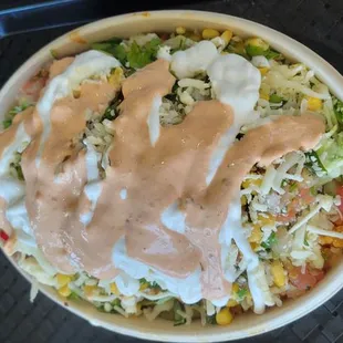 a taco salad with dressing