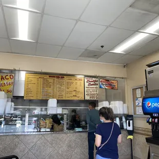 a woman standing in front of the counter