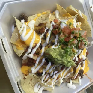 nachos in a styrofoam container