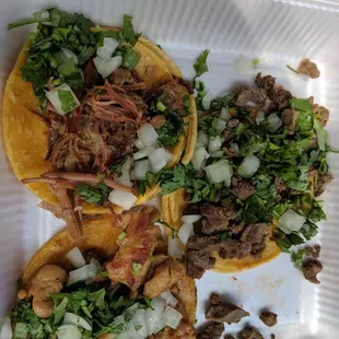 three tacoss in a styrofoam container