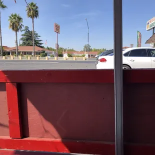 a view of a parking lot from the back of a truck