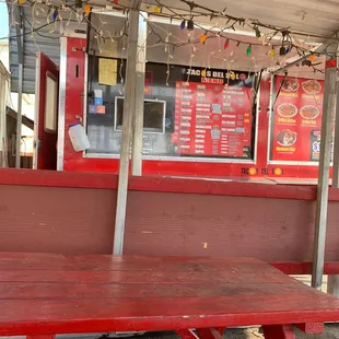 a red table and a red bench