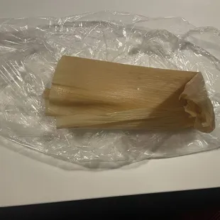 a tamales wrapped in plastic