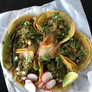 a plate of tacos on a table