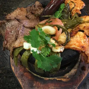 a plate of meat and vegetables