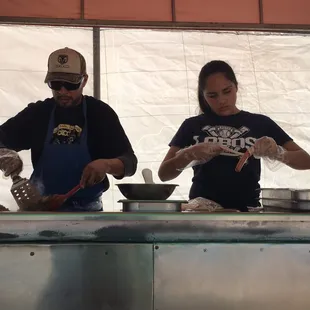 two people preparing food