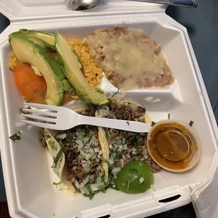 Delicious Asada Platter with Rice and Beans Avocado and Salsa