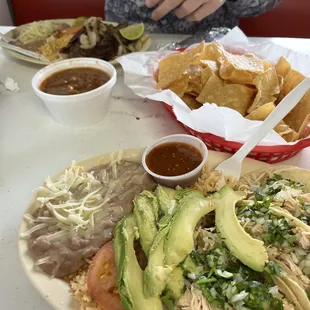 Chicken tacos, rice, and beans