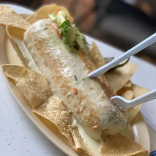 a plate of nachos with cheese