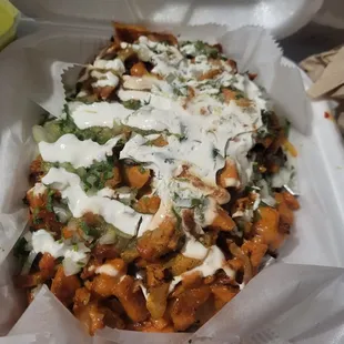 Papas rellena w/chicken: toppings+chicken had so much flavor, baked potato but it was cooked softer almost like mashed potatoes