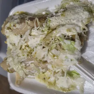 The tamale/clothing/jewelry stand next to taco truck    preparado: wasn't dry but not the most flavor even with everything on it