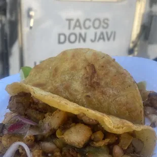 a taco on a paper plate