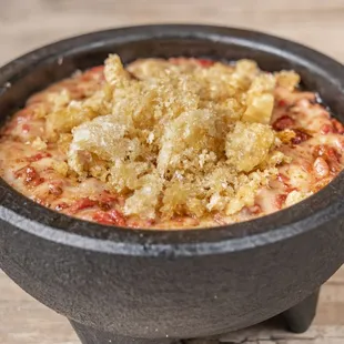 Queso Fundido - 
Melted mozzarella cheese with our house Longaniza