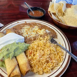 Chicken Flautas beans and rice. Tasty fresh chips and good salsa.