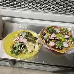 Tacos one of each meat and two of bistek on the other plate