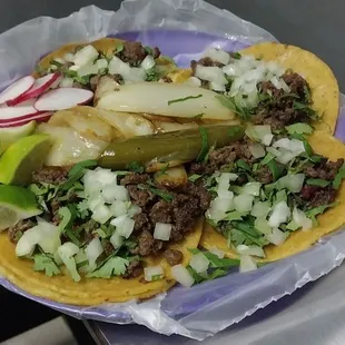 Delicious bistec tacos with all the fixings.