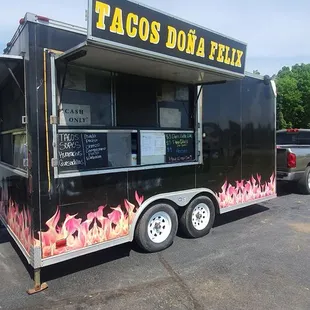 a taco truck parked in a parking lot