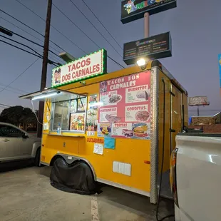 a taco truck parked in a parking lot