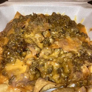 Nachos Regulares  With bean and cheese Choice of 1 meat: Asada, Bistek, Pastor, Chicken Fajita, or Beef Fajita  I picked Asada, very good!
