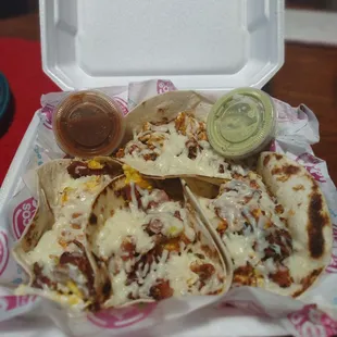 4 Breakfast tacos bacon and chorizo.