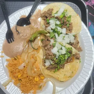 Taco plate 3 tacos, rice, and beans. Ordered an extra Taco, but ate it before I took pictures