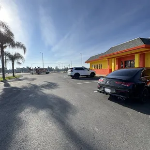 Parking, restaurant front, and taco truck