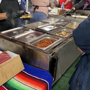 a group of people preparing food
