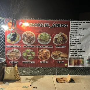 a menu on a chain link fence