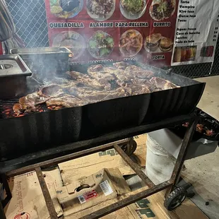 a grill with a lot of food on it