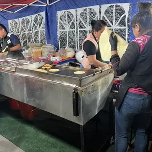 a group of people preparing food