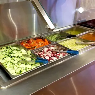 Complimentary sides, tacos come plain you put your toppings on. There is also grilled onions, jalapenos and cooked beans..