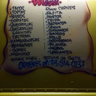 a menu on a food truck