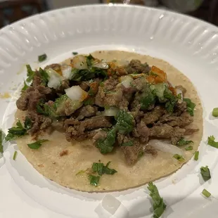 Tacos de asada with homemade corn tortilla