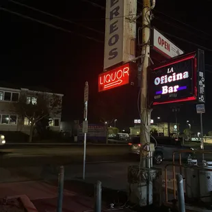 a neon sign for a liquor bar