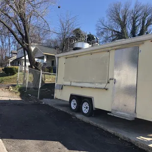 a taco truck parked on the side of the road