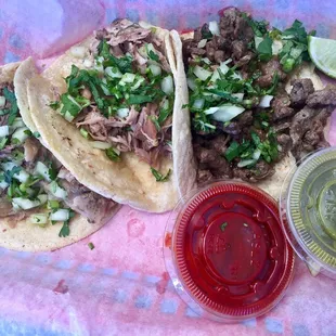 Lamb barbacoa, carnitas, asada tacos. The red sauce is so good! Both are spicy.
