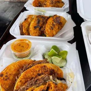 a variety of tacoss and condiments