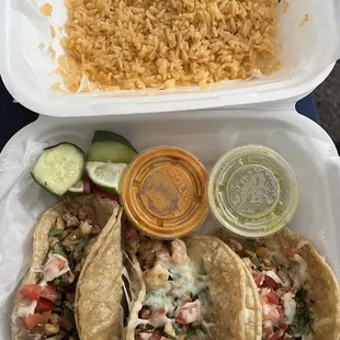 3 chicken tacos with a side of rice