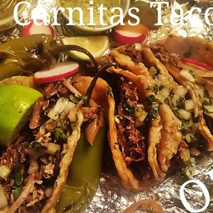 Taco Truck has a Drive thru window. Very best Carnitas Tacos  OMG got 4 $10 out the window . Salsa Limes Grilled Onions Jalapenos