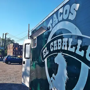 a taco truck parked in a parking lot