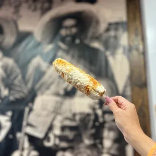 a woman holding a piece of bread