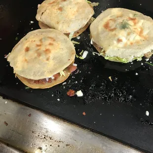 three quesadillas on a grill