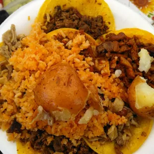 Tacos de Al pastor, asada, tripa, and buche, topped with rice and cooked potato